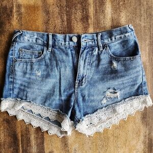Free People Size 27 denim shorts with white lace detail